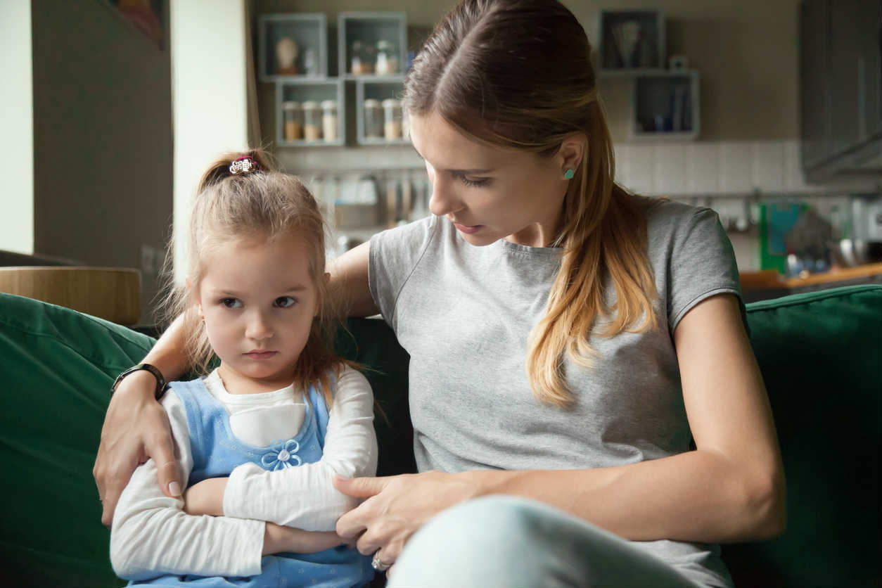 mother talking to upset daughter