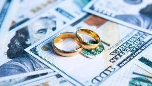 wedding rings on top of money